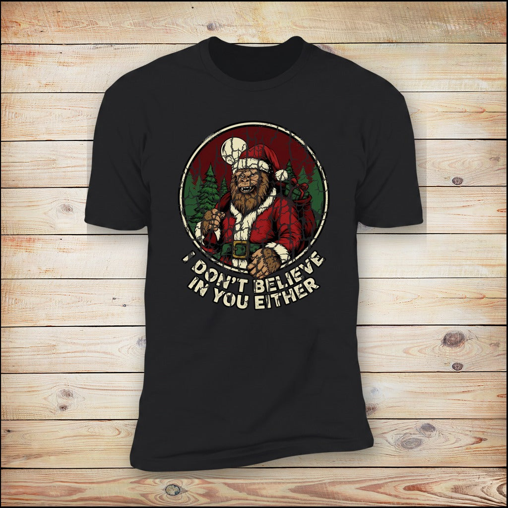 I Don't Believe In You Either Bigfoot Santa black tee on wood