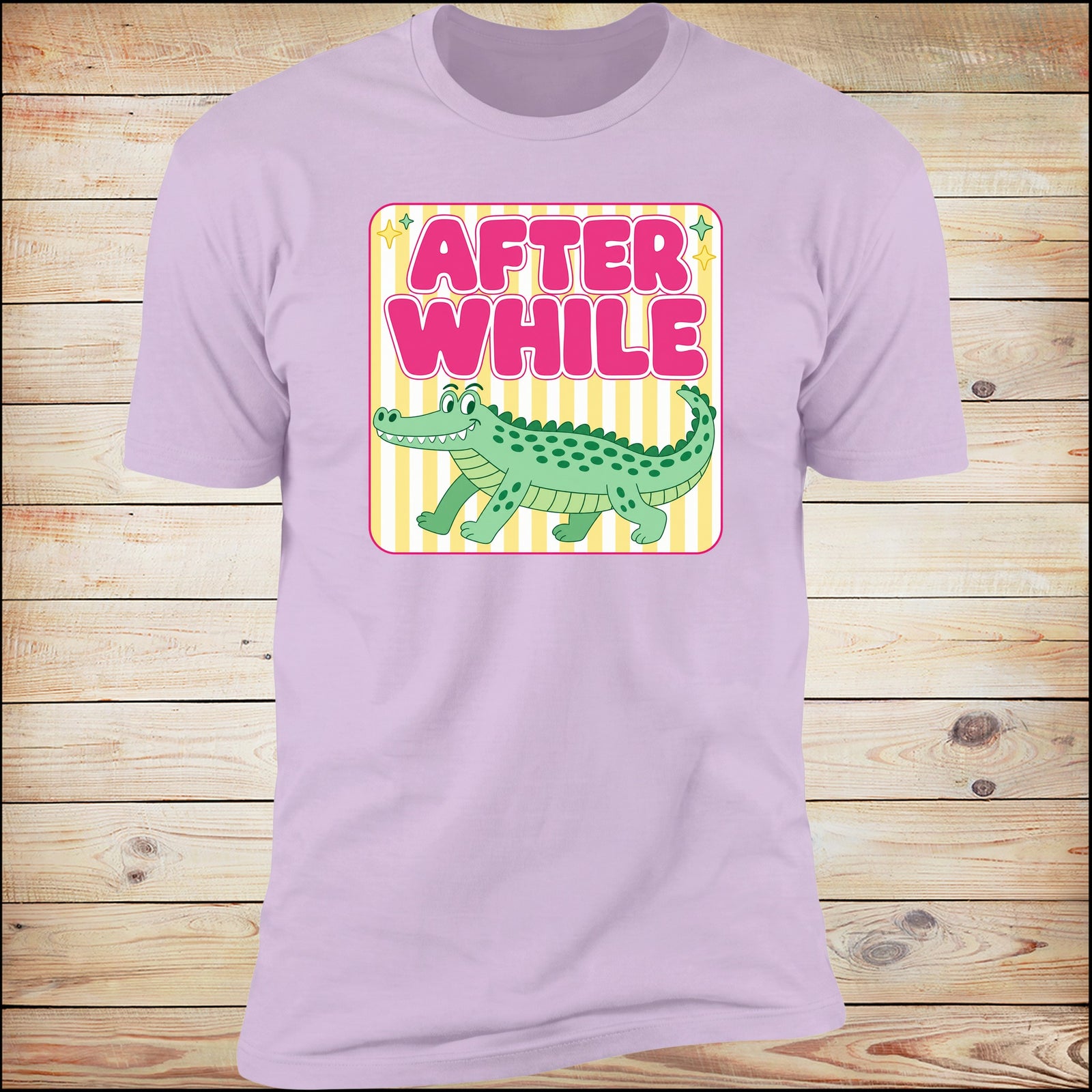 After While crocodile tee on Iris, wood background